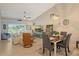 Open living and dining space featuring tile floors and a cozy seating arrangement with natural light at 9570 High Gate Dr # 1722, Sarasota, FL 34238