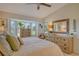 Bright main bedroom with ample natural light, neutral tones, and coastal-inspired accents for a serene atmosphere at 9570 High Gate Dr # 1722, Sarasota, FL 34238