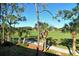 Enjoy stunning views of the golf course and surrounding greenery from this screened-in lanai at 9570 High Gate Dr # 1722, Sarasota, FL 34238
