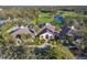 Stunning aerial view of the Rosedale Golf and Country Club featuring the clubhouse and surrounding manicured landscape at 9734 51St Terr E, Bradenton, FL 34211