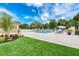 Inviting community pool with lounge chairs, umbrellas, and well-maintained landscaping at 9734 51St Terr E, Bradenton, FL 34211