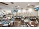 Dining area with a full bar, seating, and a stylish ambiance, perfect for social gatherings and casual dining at 9734 51St Terr E, Bradenton, FL 34211