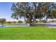 Beautiful golf course view with a bridge spanning across a water feature at 9734 51St Terr E, Bradenton, FL 34211