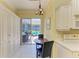 Bright eat-in kitchen with sliding glass doors to the outdoor patio at 9734 51St Terr E, Bradenton, FL 34211