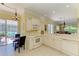 Open kitchen area with white cabinetry and plenty of natural light at 9734 51St Terr E, Bradenton, FL 34211