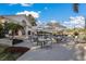 Inviting outdoor patio with tables, umbrellas, and scenic views of the manicured grounds at 9734 51St Terr E, Bradenton, FL 34211