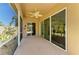 Covered outdoor patio includes ceiling fan and seamless access to the backyard at 9734 51St Terr E, Bradenton, FL 34211