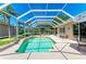 Screened-in pool and patio boasts a water feature and bright, airy atmosphere at 9734 51St Terr E, Bradenton, FL 34211