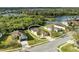 An aerial photograph of a home on a manicured corner lot with a screened in lanai and a water view at 9767 50Th Street E Cir, Parrish, FL 34219