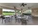 Inviting outdoor patio with multiple tables and chairs, perfect for gatherings and relaxation at 9767 50Th Street E Cir, Parrish, FL 34219