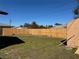 Spacious backyard featuring privacy fence and grassy lawn at 1036 Hope St, Venice, FL 34285