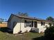 Charming single-story home with stucco exterior, decorative shutters, and well-maintained landscaping at 1036 Hope St, Venice, FL 34285