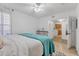 Comfortable bedroom featuring neutral colors and tile flooring offering a tranquil ambiance at 1110 Villagio Cir # 103, Sarasota, FL 34237