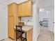 Built-in desk and cabinets offer an organized space for a home office or study area at 1110 Villagio Cir # 103, Sarasota, FL 34237