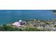 Expansive aerial view showcasing a theater with ample parking and scenic bay views, ideal for entertainment events at 1110 Villagio Cir # 103, Sarasota, FL 34237