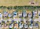 An aerial view of a residential neighborhood featuring many homes with private pools and mature trees at 11213 2Nd E Ave, Bradenton, FL 34212