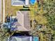 Aerial view of a home with a courtyard, mature trees, and a private backyard with a pool at 11213 2Nd E Ave, Bradenton, FL 34212