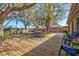 Backyard showcasing a spacious deck with multiple seating areas for outdoor relaxation and entertainment with mature trees at 11213 2Nd E Ave, Bradenton, FL 34212
