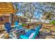 Inviting backyard with a deck, outdoor seating, and a cozy fire pit area, perfect for entertaining at 11213 2Nd E Ave, Bradenton, FL 34212