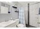 Updated bathroom featuring modern fixtures, a decorative mirror and a stand up shower with black and white accents at 11213 2Nd E Ave, Bradenton, FL 34212