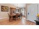 Elegant dining area with a wooden table, seating for six, and stylish decor accents at 11213 2Nd E Ave, Bradenton, FL 34212