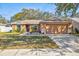 Charming single-story home with a well-manicured lawn, two-car garage, and inviting curb appeal at 11213 2Nd E Ave, Bradenton, FL 34212