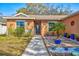 Inviting front entrance with decorative plants and a well-maintained walkway leading to the front door at 11213 2Nd E Ave, Bradenton, FL 34212