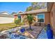Close up of front yard with a young palm tree and decorative colorful pots at 11213 2Nd E Ave, Bradenton, FL 34212