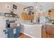 Functional kitchen with hanging pot rack, wooden cabinetry and counter space for coffee bar at 11213 2Nd E Ave, Bradenton, FL 34212