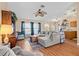 Open-concept living area with cozy furniture, natural light, and a seamless flow to other spaces at 11213 2Nd E Ave, Bradenton, FL 34212