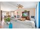 Comfortable living room with vaulted ceilings, ceiling fan, and plush sectional seating at 11213 2Nd E Ave, Bradenton, FL 34212