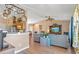 Open concept living room and kitchen with neutral tones and view to dining area at 11213 2Nd E Ave, Bradenton, FL 34212