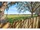 Scenic pasture view framed by trees and a wooden fence with livestock grazing peacefully in the distance at 11213 2Nd E Ave, Bradenton, FL 34212