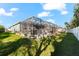 A gorgeous backyard shows off a screened in pool and lovely landscaping at 11553 11Th E Ave, Bradenton, FL 34212