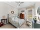 Cozy bedroom with ample natural light, a comfy chair, and neutral decor at 11553 11Th E Ave, Bradenton, FL 34212