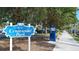 Centennial Park entrance sign showcasing the beauty and lush landscaping of the park at 129 Wayforest Dr, Venice, FL 34292