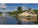 The Venice Golf and Country Club entrance, featuring well-manicured landscaping and a serene water feature at 129 Wayforest Dr, Venice, FL 34292