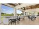 Inviting outdoor dining area with golf course views and varied seating options at 129 Wayforest Dr, Venice, FL 34292