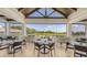 Relaxing outdoor dining area with golf course views and comfortable seating at 129 Wayforest Dr, Venice, FL 34292