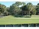 Scenic view of the golf course with rolling hills and lush greenery at 129 Wayforest Dr, Venice, FL 34292