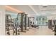 Well-equipped gym with modern fitness equipment and natural light at 129 Wayforest Dr, Venice, FL 34292