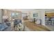 Bright living room connected to kitchen and dining areas, perfect for modern living at 129 Wayforest Dr, Venice, FL 34292