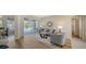 Comfortable living space with views of the pool area, perfect for relaxing and entertaining at 129 Wayforest Dr, Venice, FL 34292