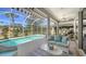 Inviting screened-in pool area offering a private outdoor oasis with comfortable seating at 129 Wayforest Dr, Venice, FL 34292