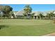 A meticulously maintained putting green offers a serene space for leisure, set against a backdrop of elegant homes at 129 Wayforest Dr, Venice, FL 34292
