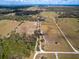 Aerial view of vast farm land with pastures and woods at 15101 Rawls Rd, Sarasota, FL 34240