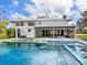 Backyard featuring a swimming pool, lounge area, and a covered outdoor dining space at 15101 Rawls Rd, Sarasota, FL 34240
