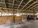 Inside view of horse stalls in the barn featuring wood construction and concrete floors at 15101 Rawls Rd, Sarasota, FL 34240