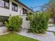 Modern home exterior featuring well-maintained landscaping, and spiral staircase to an upper level deck at 15101 Rawls Rd, Sarasota, FL 34240