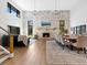 Spacious living room with a stone fireplace, hardwood floors, and elegant furnishings at 15101 Rawls Rd, Sarasota, FL 34240